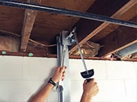 Straightening a foundation wall with the PowerBrace™ i-beam system in a Sheperdsville home.