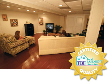 A remodeled basement with the Total Basement Finishing™ badge