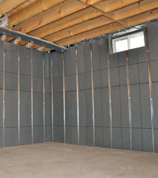 Basement To Beautiful™ panels installed on a basement wall that's ready to be finished.