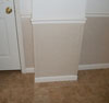 A closeup of our completed drywall repair system.  On the floor are our warrantied ThermalDry® floor tiles.