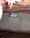 Indiana and Kentucky crawl space with vents, showing mold, rot, and fiberglass insulation dripping off the ceiling.