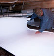 Jasper insulation being installed in a crawl space.