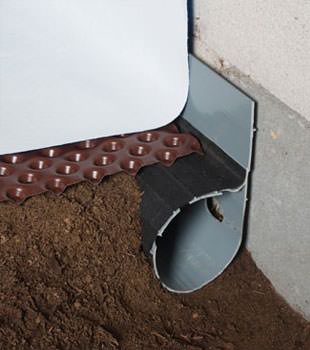 Closeup of a crawl space drainage system installed in Hardinsburg