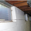 A foundation showing severe inward buckling along the windows in a Central City home.