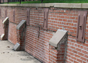 Rusted wall plate anchors in a retaining wall repair in Chandler.