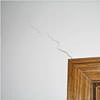 wall cracks along a doorway in a Spottsville home.