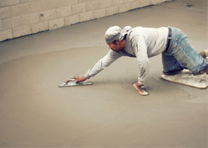 smoothing out the grout in a slab releveling project in Jasper