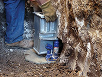 Securing a foundation footing bracket for a foundation repair system in Boonville.