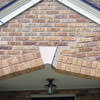 Major tuckpointing on a home archway over a door, with tuckpointing several inches wide that has failed on a Evansville home