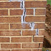 Tuckpointing that cracked due to foundation settlement of a Owensboro home