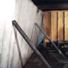 Temporary foundation wall supports stabilizing a Vincennes home