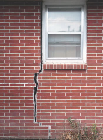 severe foundation wall cracks along a window in Petersburg
