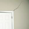A long drywall crack beginning at the corner of a doorway in a Marion home.