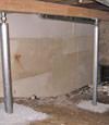 A system of crawl space support posts adding structural support to a crawl space in Rockport