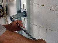 Mounting a foundation wall channel anchor in Jasper.