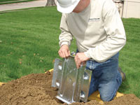 Fastening an earth anchor for a severely bowing wall in Haubstadt.