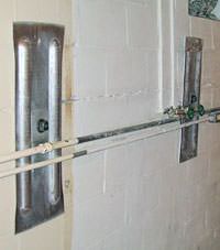 A foundation wall anchor system used to repair a basement wall in Dawson Springs