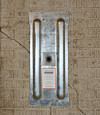 A fully exposed wall anchor plate installed along a Mount Vernon foundation wall