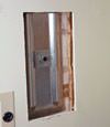 Wall anchor plates installed during a foundation repair in Owensboro in a finished basement