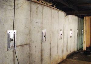 A foundation wall in Oakland City repaired with foundation wall anchors.