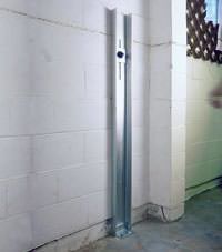 A failing foundation wall repaired with a foundation wall channel anchor system in a Vincennes home.
