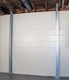 A steel i-beam system installed on a Mount Vernon foundation wall