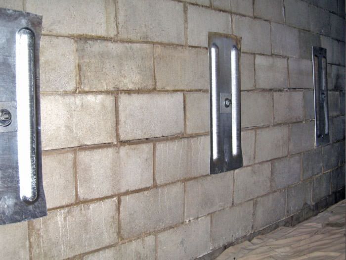 Foundation Repair Contractor In Evansville Owensboro Newburgh An Inside View Of Foundation Wall Anchors Installed Along A Basement To Brace And Repair