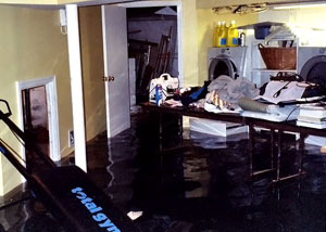 A laundry room flood in Spottsville, with several feet of water flooded in.