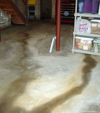 Flooding entering a basement through a floor crack in Marion