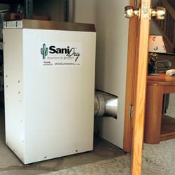 A basement dehumidifier with an ENERGY STAR® rating ducting dry air into a finished area of the basement  in Rockport