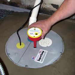 A newly installed sump pump system in a basement in Dawson Springs