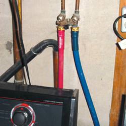 Washer hoses in a basement  in Oakland City