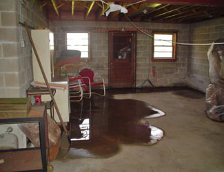 a flooded basement floor in a Rockport home