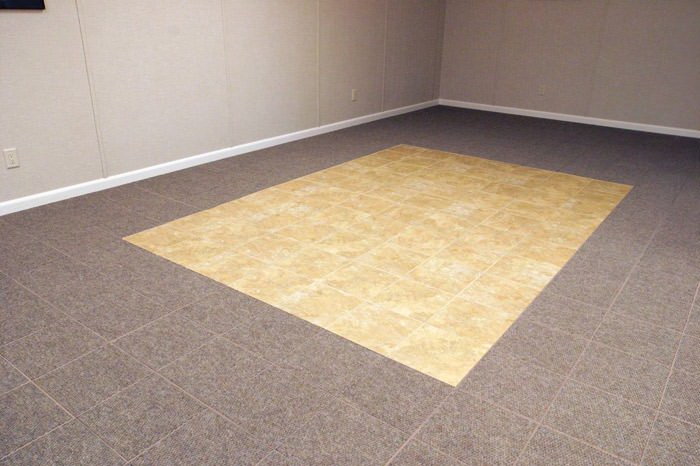 tiled and carpeted basement flooring installed in a Henderson home